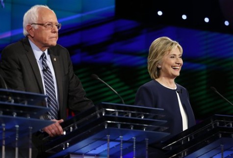 Hillary Rodham Clinton, right, smiles as Sen. Bernie Sanders, of Vermont, speaks during the CNN Democratic presidential debate Tuesday, Oct. 13, 2015, in Las Vegas. (AP Photo/John Locher)