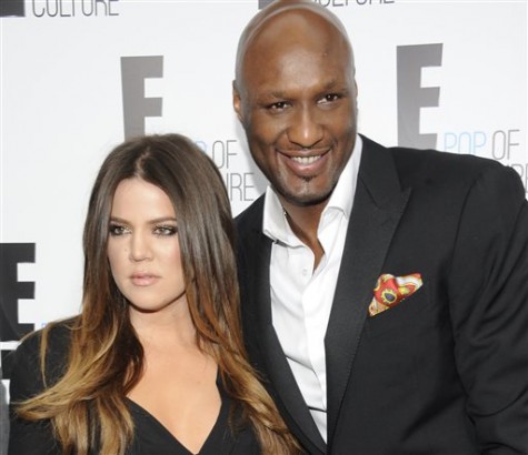 FILE - In this April 30, 2012 file photo, Khloe Kardashian Odom and Lamar Odom from the show "Keeping Up With The Kardashians" attend an E! Network upfront event at Gotham Hall in New York. Odom, the former NBA star and reality TV personality embraced by teammates and fans alike for his humble approach to fame, was hospitalized and his estranged wife Khloe Kardashian is by his side, after being found unresponsive in a Nevada brothel where he had been staying for days. (AP Photo/Evan Agostini, File)
