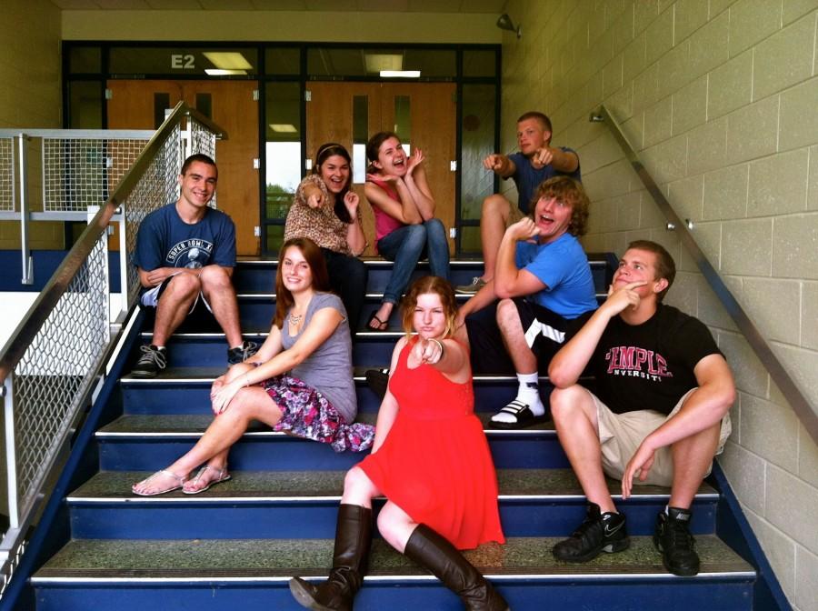 Knight Crier senior Staff Writers pose in the E-pod stair case for one last picture together 