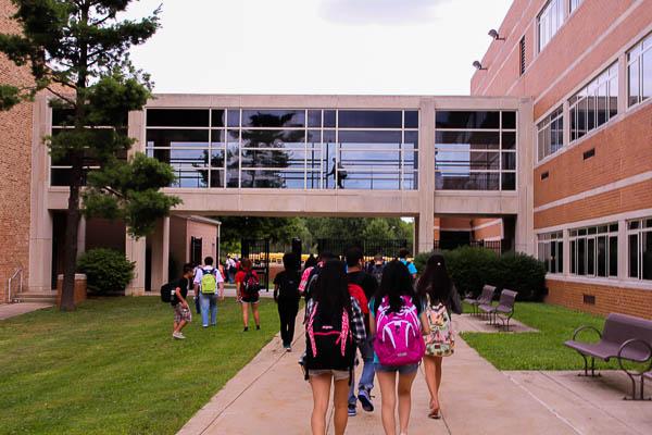 FILE PHOTO: Students make their way to classes during passing time earlier this school year at North Penn High School. 