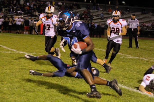 KNIGHTS FLY BY FALCONS: North Penn Knight Keith Earle carries the ball against Pennsbury on October 17. North Penn upset Pennsbury 24-21 to hand the Falcons their first loss of the 2014 season.