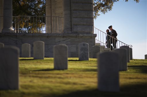 U.S. Army World War II and Korean War veteran Robert Bukofske, 85, right, walks with his neighbor Roberto Rodriguez through the tombstones at Marietta National Cemetery on Veterans Day, Tuesday, Nov. 11, 2014, in Marietta, Ga. It gives you an awful feeling, its a lot to think about, said Bukofske. Theres a lot of memories and history and something many people today dont think about. Rodriguez, who makes it a point to spend time with Bukofske since his wife past away several years ago, took him out for lunch before stopping by the cemetery. Theyre a special generation, they built this country. Its a shame because theyre not that many of these guys left, says Rodriguez. (AP Photo/David Goldman)