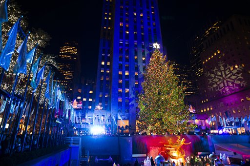 In a Wednesday, Nov. 28, 2012 file photo, the 80-foot-tall Rockefeller Center Christmas tree is lit using 45,000 energy efficient LED lights during the 80th annual lighting ceremony in New York. The tree comes from the Mount Olive, N.J., home of Joe Balku, who lost power and other trees during the storm. Its now covered in 30,000 lights and will remain on view until Jan. 7. While youre at Rock Center, watch the ice skaters, take in the Radio City Christmas Spectacular or visit St. Patricks Cathedral on Fifth Avenue.(Photo by Charles Sykes/Invision/AP, File)