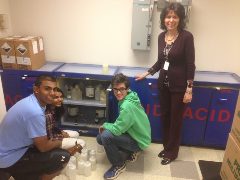 They have great chemistry! North Penn High School Lab Aides Joe John, Rudmilla Rashid, and Steven Thornton work with science teacher Mrs. Kathy Groat to ready the labs for the next day of science classes. 