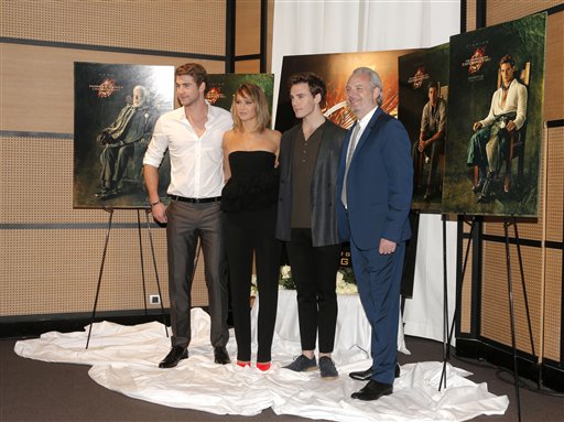 From left, actors Liam Hemsworth, Jennifer Lawrence, Sam Claflin and director Francis Lawrence pose for photographers during a photo call for the film The Hunger Game: Catching Fire at the 66th international film festival, in Cannes, southern France, Saturday, May 18, 2013. (Photo by Todd Williamson/Invision/AP)