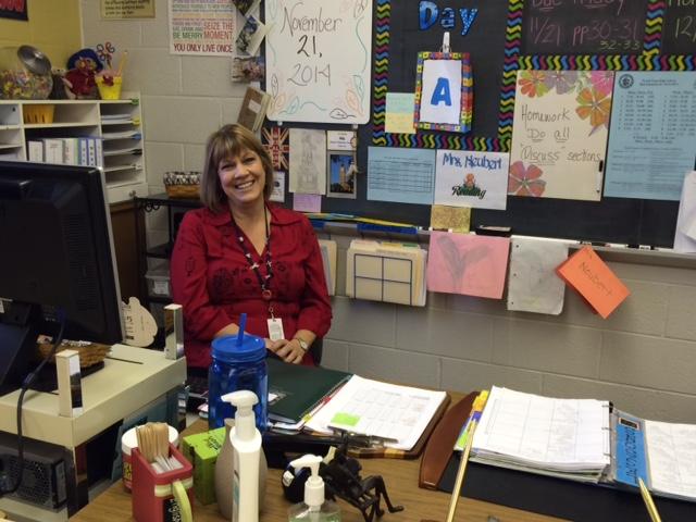 North Penn Reading Teacher Cheryl Neubert sits behind her desk in her classroom, home of a dedicated teacher. 