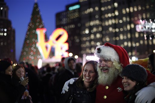 Harry M. Bratton III poses for photographs at John F. Kennedy Plaza, also known as Love Park, before the lighting of the citys Christmas tree Thursday, Dec. 8, 2011, in Philadelphia. (AP Photo/Matt Rourke)