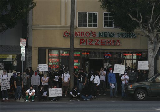 Members of an internet-based group called Anonymous protest near buildings associated with the Church of Scientology on Sunday, Feb. 10, 2008, in the Hollywood section of Los Angeles.  (AP Photo/Chris Weeks)