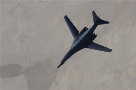 In this Saturday, Sept. 27, 2014 photo released by the U.S. Air Force, a B-1B Lancer disengages from a KC-135 Stratotanker after refueling during U.S.-led airstrikes on Islamic State group targets in Syria. Nearly 2 out of 3 Americans back U.S. airstrikes to combat Islamic extremists and half also think there's a high risk of a future terrorist attack on American soil. Americans surveyed for an Associated Press-GfK poll are split on whether they approve of the way President Barack Obama is generally handling the threat from the Islamic State group and other terrorists. Yet despite more than a decade of costly war, about a third favor going even beyond airstrikes and putting U.S. military boots on the ground in Iraq or Syria  something Obama says he has no plans to do. (AP Photo/Staff Sgt. Ciara Wymbs, U.S. Air Force)