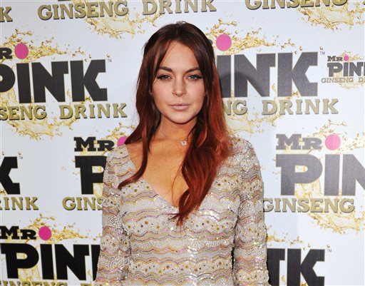 FILE - In this Oct. 11, 2012 file photo, Lindsay Lohan attends the Mr. Pink Ginseng launch party at the Beverly Wilshire hotel in Beverly Hills, Calif. A scheduling hearing for a case alleging Lohan lied to police, drove recklessly and obstructed officers from performing their duties is scheduled for Wednesday, Jan. 30, 2013, before a judge who has previously sentenced the actress to house arrest and jail time. (Photo by Richard Shotwell/Invision/AP, File)