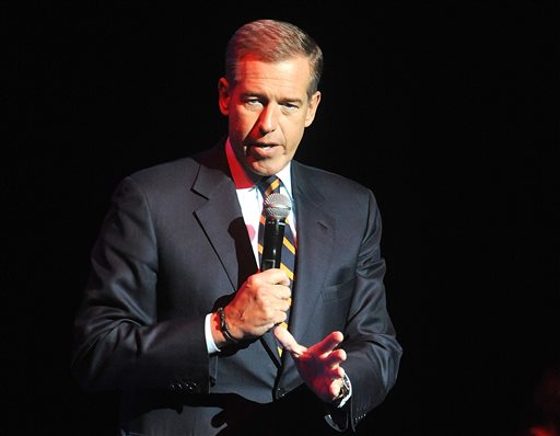 FILE - In this Nov. 5, 2014 file photo, Brian Williams speaks at the 8th Annual Stand Up For Heroes, presented by New York Comedy Festival and The Bob Woodruff Foundation in New York. NBC says it is suspending Brian Williams as Nightly News anchor and managing editor for six months without pay for misleading the public about his experiences covering the Iraq War. NBC chief executive Steve Burke said Tuesday, Feb. 10, 2015, that Williams actions were inexcusable and jeopardized the trust he has built up with viewers during his decade as the networks lead anchor. (Photo by Brad Barket/Invision/AP, File)