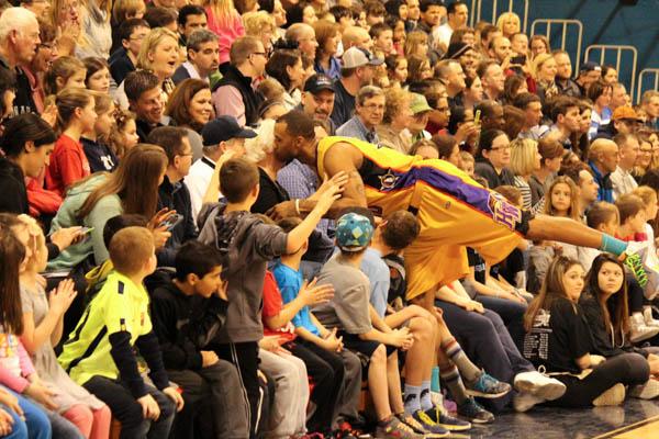 PUCKER UP:  A member of the Harlem Wizards leans in for a kiss during the 2015 Harlem Wizards basketball game at North Penn High School. The game was the 2nd annual booster club sponsored event held in the NPHS gymnasium. 