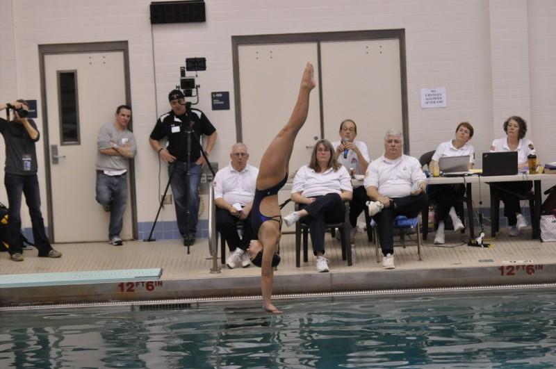RECORD SETTER: North Penn High School junior Marie Yacopino dives at the 2015 district diving meet on Monday, February 23, 2015. Yacopino leads a trio of Maidens headed to states. 