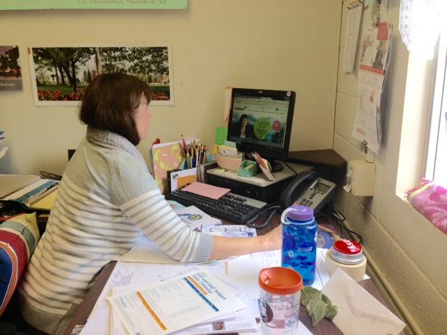 North Penn High School Counselor Mrs. Christine McCreary checks the College Board website before meeting with several students to discuss course selection and college plans.