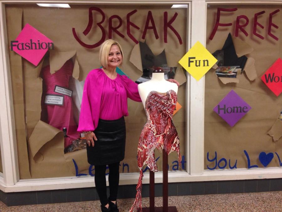 North Penns Mrs. Townsend poses with one of the most desired prom dresses in the giveaway, Lady Gagas famous Meat Dress.