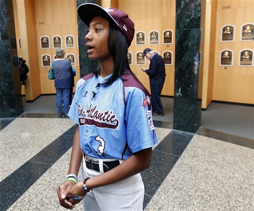FILE - In this Sept. 25, 2014, file photo, Little League pitcher Mone Davis talks to reporters in the Plaque Gallery at the Baseball Hall of Fame in Cooperstown, N.Y. Mone Davis believes in second chances. Davis told ESPN on Monday, March 23, 2015, that she sent an email to Bloomsburg University in Pennsylvania to request it reinstate first baseman Joey Casselberry. Davis says everyone makes mistakes after Casselberry called her a crude name while criticizing the Disney Channel for making a movie about her.  (AP Photo/Mike Groll, File)