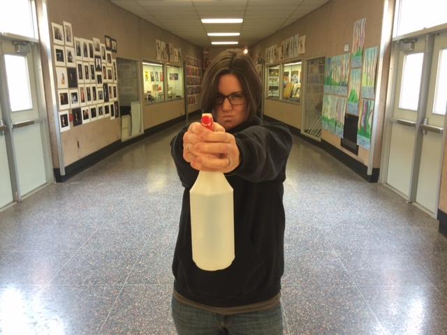 BREAK IT UP YOU CRAZY KIDS! Mrs. Katie Kelley threatens PDA with her intimidating spray bottle. Her efforts have proven ineffective. 