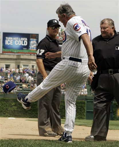 FILE - In this June 2, 2007, file photo, Chicago Cubs manager Lou Piniella, center, kicks his cap as he argues with third base umpire Mark Wegner, left, and home plate umpire Bruce Froemming watches during the eighth inning of a baseball game against Atlanta Braves in Chicago. Major League Baseball announced Thursday, Jan. 16, 2014, that owners, players and umpires have approved a new instant replay system to review close calls. (AP Photo/Nam Y. Huh, File)