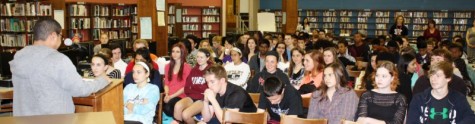 NPHS student Austin Zotomayor reads to a captive audience at the Reading Riot 