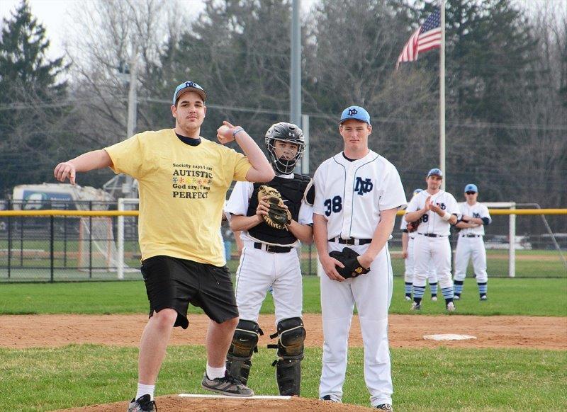 NPHS student Ben Harftranft caps off a week of autism awareness by throwing out the first pitch in the North Penn Knights baseball game vs. Souderton.