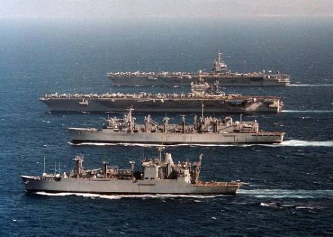 The ammunition ship USS Mount Baker, bottom, followed by the fast combat support ship USS Supply, the nuclear powered aircraft carrier USS George Washington, and nuclear aircraft carrier USS Enterprise, top, cruise the waters of the western Mediterranean Sea during extensive turnover operations, Friday July 12, 1996. The George Washington is nearing completion of her second scheduled deployment since her commissioning, while the USS Enterprise, the Navy's oldest active nuclear powered aircraft carrier,returns to sea for her first scheduled deployment in several years following a complex ships overhaul, that included her nuclear propulsion systems.(AP Phot/ Navy Photo, Jim Vidrine)