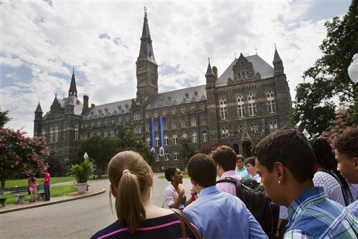 FILE - In this July 10, 2013, file photo, prospective students tour Georgetown Universitys campus in Washington. Despite all the grumbling about tuition increases and student loan costs, other college expenses also are going up. The price of housing and food trumps tuition costs for students who attend two- and four-year public universities in their home states. Thats according to a College Board survey. Even with the lower interest rates on student loans that President Barack Obama signed into law, students are eyeing bills that are growing on just about every line.  (AP Photo/Jacquelyn Martin, File)