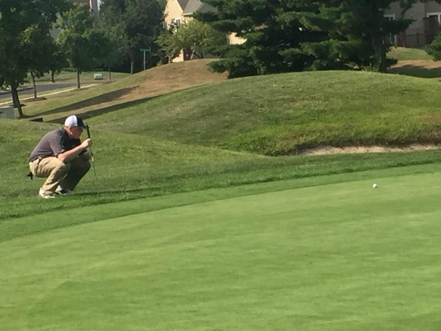 North Penns Billy Donovan eyes up a put during the Knights home match vs CB East.