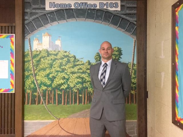 Mr. Stefan Muller stands outside his new home in North Penn High School - home office D103.