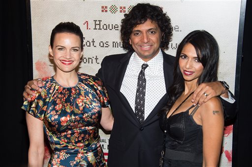 Carla Gugino, left, M. Night Shyamalan, center, and Bhavna Vaswani attend a special screening of The Visit at the Regal Union Square on Tuesday, Sept. 8, 2015, in New York. (Photo by Charles Sykes/Invision/AP)