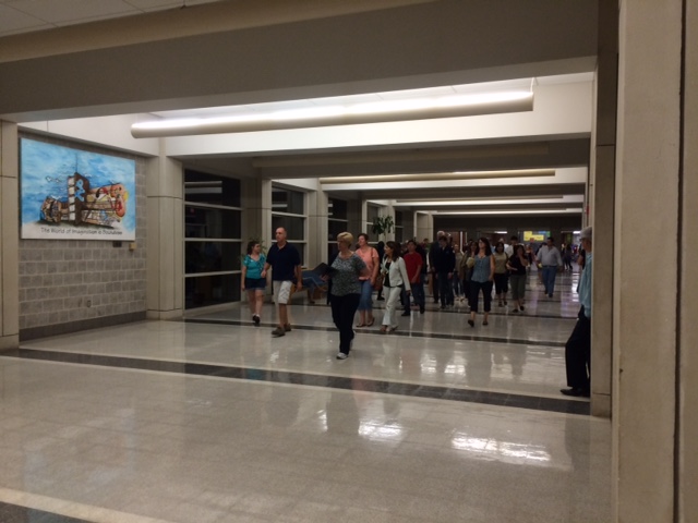 Parents walk through the concourse as they try to get to the next class on their childs schedule.