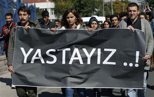 A group of students from Ankara University march to protest the deadly Saturday explosions in Ankara, Turkey, Wednesday, Oct. 14, 2015. Turkey has intelligence suggesting that militants originating from Syria were planning to carry out attacks in Turkey, Turkish President Recep Tayyip Erdogan, speaking at a joint news conference with the visiting Finnish president, said Tuesday, but added that no groups were being ruled out in the investigation into a deadly attack on a peace rally. The banner reads:  We are mourning. (AP Photo/Emrah Gurel)