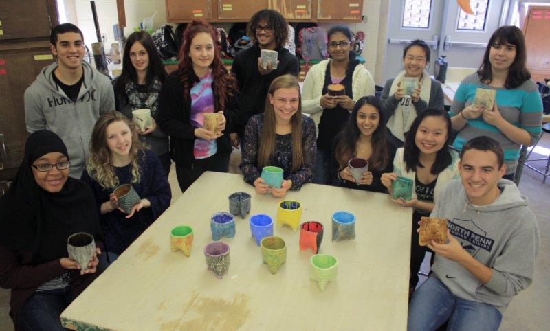 SOUPS ON! Students in Joanne Carricks Ceramics 2 class display their work which will be put to use at the Empty Bowl Dinner at Arcadia University.