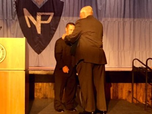 Daniel Gallagher receiving his Special Recognition medal from NPAAA President Thomas Strickland. Gallagher is the first individual to earn this recognition.