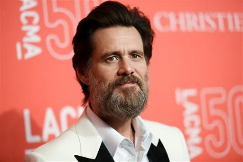FILE - In this April 18, 2015 file photo, Jim Carrey arrives at LACMA's 50th Anniversary Gala in Los Angeles. Carrey says he was shocked and saddened to learn of the death of ex-girlfriend Cathriona White, likening the news to being hit by a lightning bolt. The 30-year-old makeup artist was found dead in her Sherman Oaks apartment on Monday, Sept. 28, according to the Los Angeles County Coroners Office. Her death is being investigated as a possible suicide in the ongoing case with an examination scheduled for Wednesday. (Photo by Richard Shotwell/Invision/AP, File)