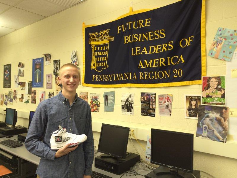 Sneaking into the business world: Peter Laurens, a NPHS student and member of FBLA has turned his sneaker hobby into a business.