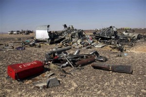 Egyptian security forces stand guard by debris of a Russian airplane at the site a day after the passenger jet bound for St. Petersburg, Russia crashed in Hassana, Egypt, on Sunday, Nov. 1, 2015. The Metrojet plane, bound for St. Petersburg in Russia, crashed 23 minutes after it took off from Egypt's Red Sea resort of Sharm el-Sheikh on Saturday morning. The 224 people on board, all Russian except for four Ukrainians and one Belarusian, died. 