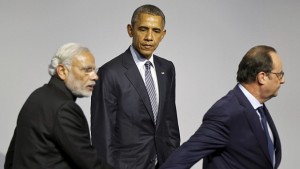 President Obama with French host Francois Hollande as he walks with Indian Prime Minister Narendra Modi at a clean energy symposium during the COP21 summit. 