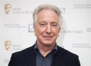 FILE - In this Wednesday, April 15, 2015 file photo, actor Alan Rickman poses for photographers on arrival at 'BAFTA A Life In Pictures, with Alan Rickman'  in central London.  British actor Alan Rickman, whose career ranged from Britains Royal Shakespeare Company to the Harry Potter films, has died. He was 69.  Rickmans family said Thursday, Jan. 14, 2016 that the actor had died after a battle with cancer. )