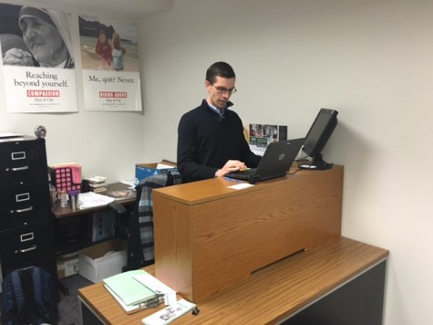 NPHS Guidance Counselor Sam Feeney gets some work done at his new stand-up desk. Feeney feels that sitting for extended periods of time is detrimental to one's overall health, and the stand up desk is his first step in reversing some of those negative effects of the sedentary position. 