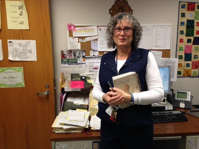 IM POSITIVE! North Penn High School nurse Sally Kauffman holds her Word of the Day book that she is using as a grass roots effort to spread positivity in the NPHS climate. 