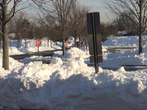 Where's my car? Piles of snow stand where cars would normally be on a Monday afternoon at NPHS.