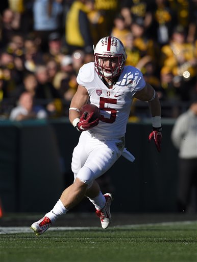 Stanford running back Christian McCaffrey runs the ball against Iowa during the first half of the Rose Bowl NCAA college football game, Friday, Jan. 1, 2016, in Pasadena, Calif. (AP Photo/Mark J. Terrill)