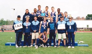 STATE CHAMPS: Swanker and assistant coaches Ron Jaros and Dave Franek celebrate the 2002 Track and Field state title with the team.