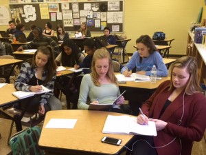 Students in the Creative Writing course work on their villanelles. Poetry is one of many writing styles taught in the class.