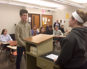 Students in the debate course watch as two of their classmates debate Summer vs. Winter.