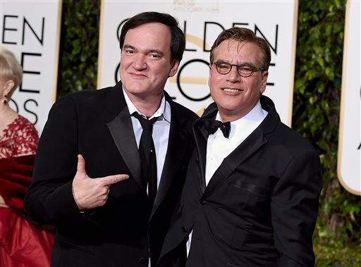 Quentin Tarantino, left, and Aaron Sorkin arrive at the 73rd annual Golden Globe Awards on Sunday, Jan. 10, 2016, at the Beverly Hilton Hotel in Beverly Hills, Calif. 