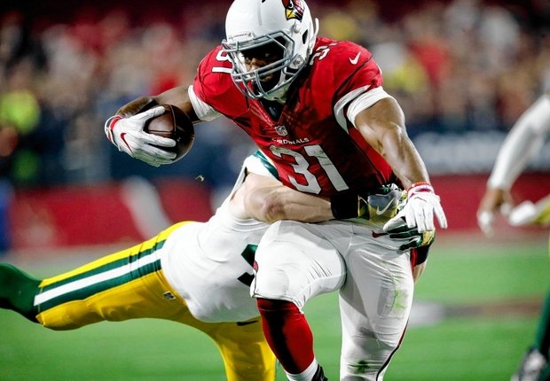 Arizona Cardinals running back David Johnson (31) is hit by Green Bay Packers inside linebacker Jake Ryan (47) during the first half of an NFL divisional game last Saturday in Glendale, Ariz. (Ross D. Franklin | The Associated Press)