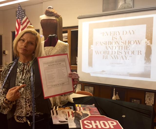 North Penn Fashion teacher Ms. Joelle Townsend with her fashion citation for students who choose to break the new, stricter dress code.