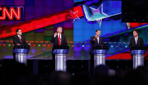 Republican presidential candidate, Sen. Ted Cruz, R-Texas, speaks, as Republican presidential candidates, Sen. Marco Rubio, R-Fla., left, and businessman Donald Trump attempt to interrupt, during the Republican presidential debate sponsored by CNN, Salem Media Group and the Washington Times at the University of Miami,  Thursday, March 10, 2016, in Coral Gables, Fla. Republican presidential candidate, Ohio Gov. John Kasich is at right. (AP Photo/Wilfredo Lee)