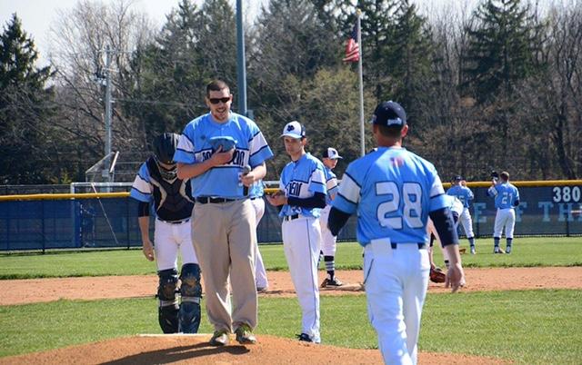 NPHS student Ben Hartranft walks off the mound after performing the National Anthem at the North Penn Knights Autism Awareness Day game on Thursday, April 14, 2016.